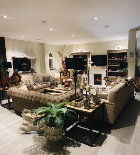 a large living room with a couch and a table at La Fuentona de Santillana in Vispieres