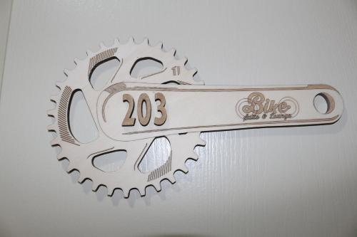 a metal gear with a sign that reads bike time at Bike Suite in Figueira da Foz