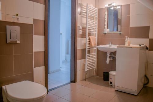 a bathroom with a toilet and a sink at Ubytovanie V Súkromí Samuel in Myjava