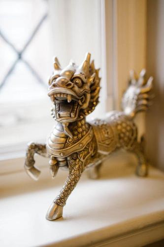 a toy horse is sitting on a window sill at Prince of Wales - Townhouse in London