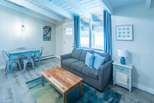 a living room with a couch and a table at Boutique Suite #4 in Blue Mountains