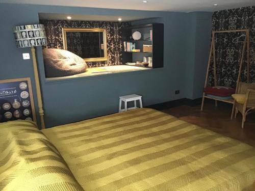 A bed or beds in a room at Chorlton Garden Rooms. Relax, work, stay and play.