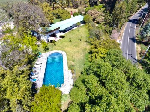 an aerial view of a house with a swimming pool at The White House by Casona Lo Aguirre - El Monte RM in Talagante