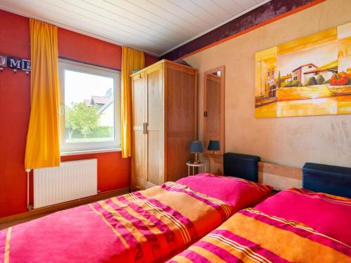 a bedroom with two beds and a window at Idyllic Bungalow in Pepelow with Garden near Seabeach in Pepelow