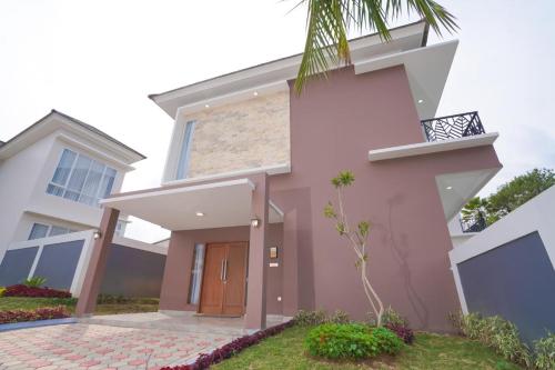 a rendering of a pink house at Marseillia Hills in Puncak