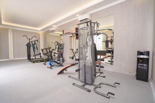 a gym with several exercise bikes in a room at Marseillia Hills in Puncak