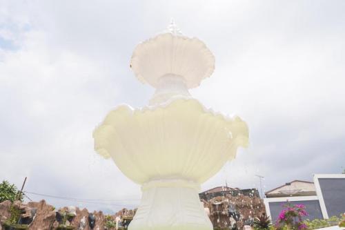 a sculpture of a woman in a white dress at Marseillia Hills in Puncak