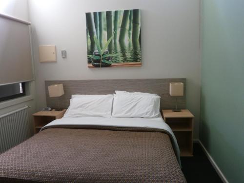 En eller flere senge i et værelse på Sovereign Views Apartments