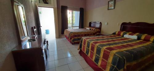 Postel nebo postele na pokoji v ubytování Hotel San Miguel