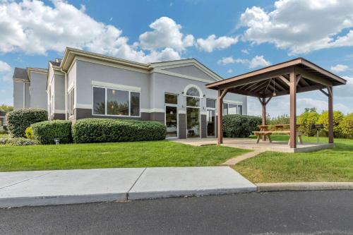 a house with a gazebo in front of it at Comfort Inn & Suites Butler in Butler