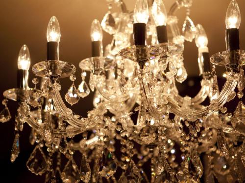 a close up of a chandelier with lights at Hotel Fine Garden Toyonaka Osaka International Itami Airport in Toyonaka