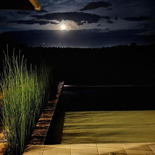 a view of the moon from a patio at night at San Miguel de Montenegro in Montenegro