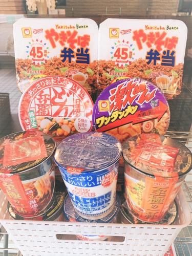 a bunch of food in plastic containers on a shelf at Hotel All In Well in Hakodate