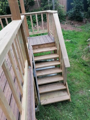 a wooden staircase leading up to a deck at Tipergwendiou in Plougonvelin