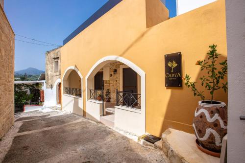 a building with arches on the side of it at Carya Residence in Karotí