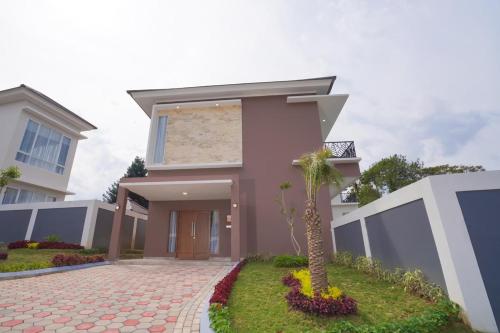 a rendering of a house with a palm tree at Marseillia Hills in Puncak