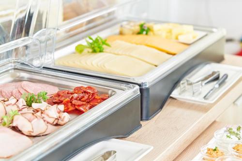 a refrigerator filled with lots of different types of food at Pension Kral in Rust