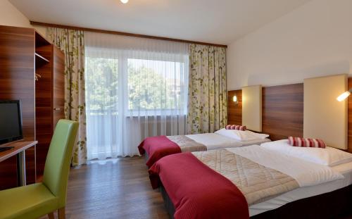 Un pat sau paturi într-o cameră la Haus Lukas