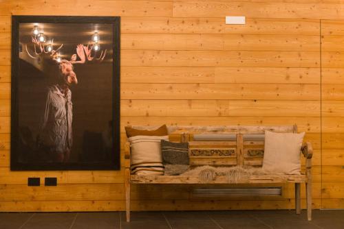 a wall with a picture of a deer on it at Residence Adamello Resort in Ponte di Legno