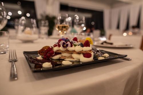 a plate of food on a table with a dessert at Hotel Monte Sarago in Ostuni