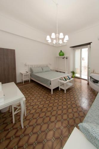 a living room with a bed and a table at La Serva Padrona in Taranto