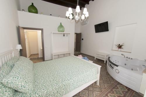 a bedroom with a bed and a bath tub at La Serva Padrona in Taranto