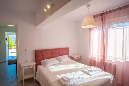 Postel nebo postele na pokoji v ubytování Remvi GUEST HOUSE