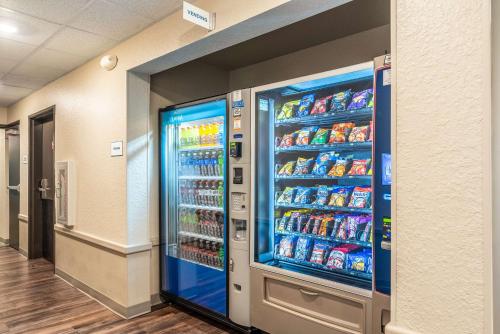 a large soda vending machine in a building at WoodSpring Suites Sanford North I-4 Orlando Area in Sanford