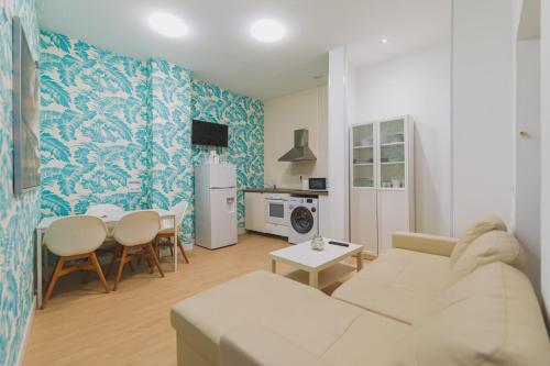 A kitchen or kitchenette at Apartamentos casa palacio