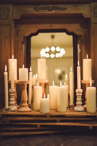 a group of candles in front of a mirror at Meee Kameari in Tokyo