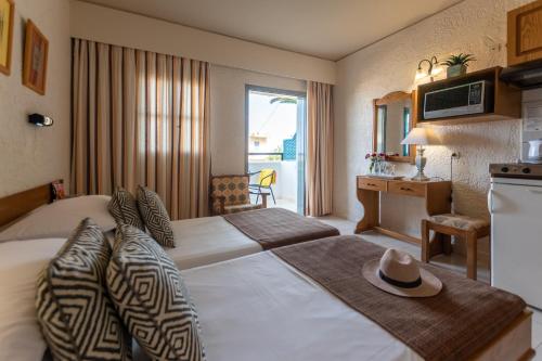 Ένα ή περισσότερα κρεβάτια σε δωμάτιο στο Dedalos Hotel