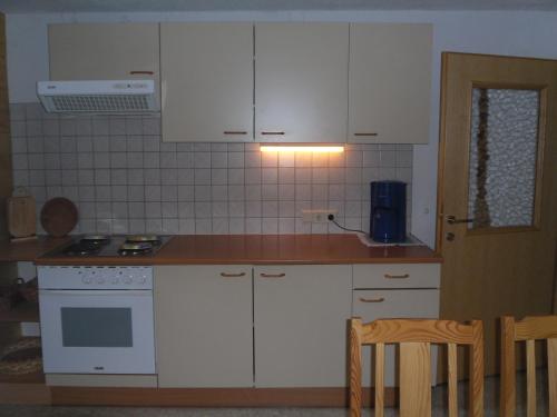 Una cocina o zona de cocina en Brunnfeld Ferienwohnungen