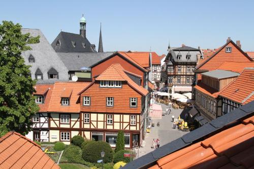 a view of a town with buildings and a street at Altwernigeröder Apparthotel in Wernigerode