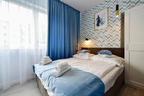 Posteľ alebo postele v izbe v ubytovaní Candy Apartments Warszawa