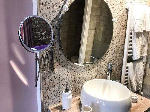 a bathroom with a sink and a mirror at La Casona de Alútiz & Bodega in Samaniego
