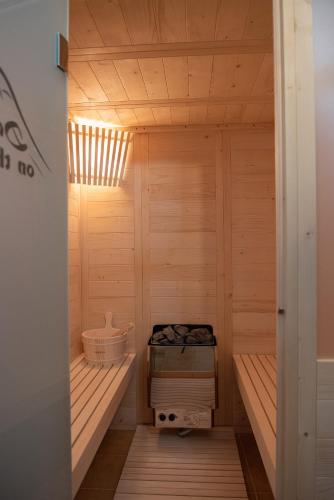 a sauna with wooden walls and a wooden floor at Dandy Villas Nymfaio - Snow Fairy - Sauna in Nimfaíon