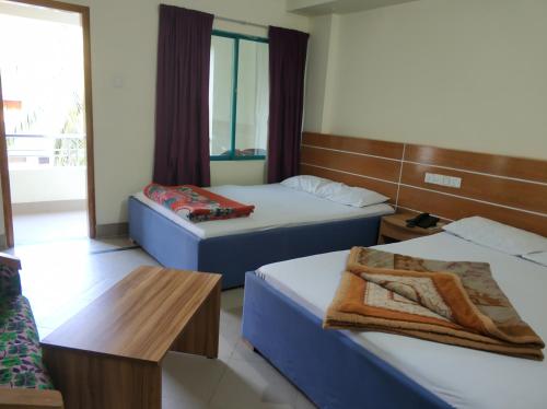 Кровать или кровати в номере Hotel Mishuk