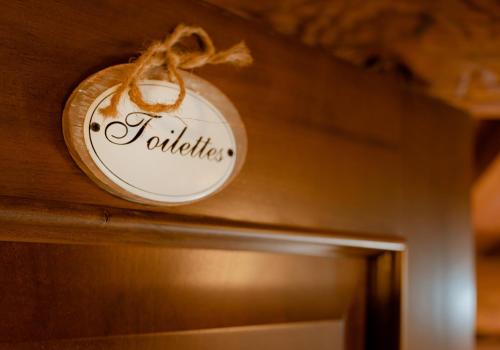 a clock hanging on a wall above a door at Casa Stefy in Montagnana
