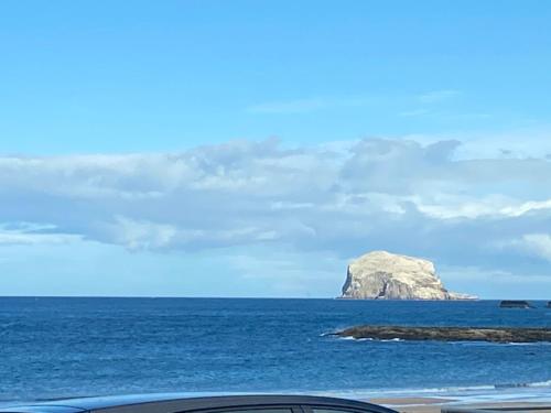 a rock in the middle of the ocean at Breakwater in North Berwick
