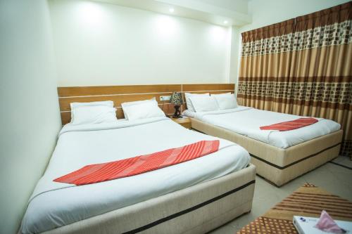 Кровать или кровати в номере Hotel Mishuk
