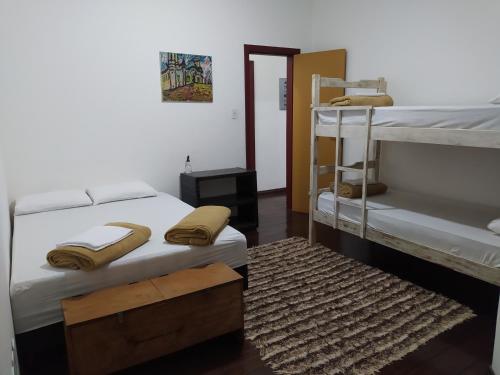 Postel nebo postele na pokoji v ubytování Trilhas de Minas Hostel Camping