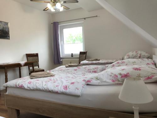 Katil atau katil-katil dalam bilik di Ferienwohnung mit Brockenblick