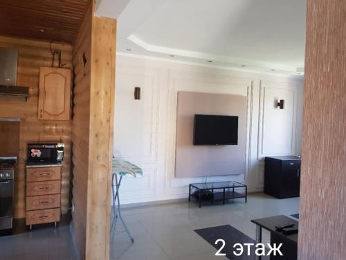 Coin salon dans l'établissement Guest House Mirny с бассейном