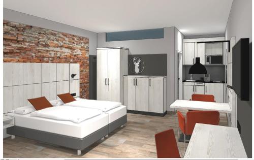a living room with a bed and a kitchen at Boardinghouse Hirsch - Apartments in Kork in Kehl am Rhein