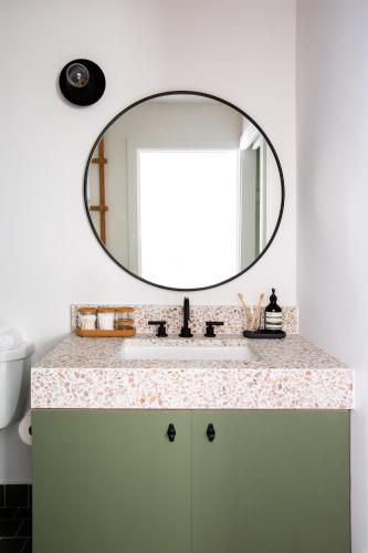 a bathroom with a sink and a mirror at White Water in Cambria