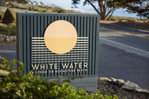 a sign for white water and a road at White Water in Cambria