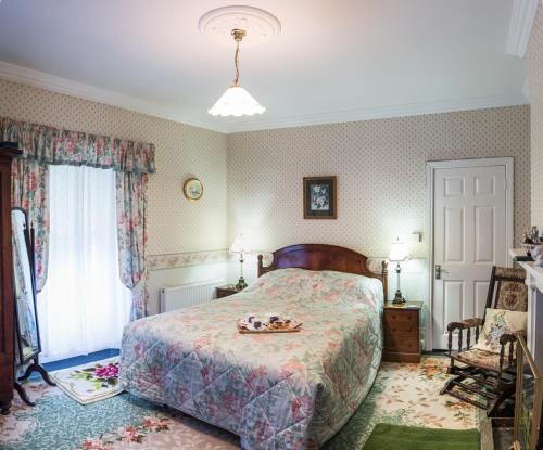 מיטה או מיטות בחדר ב-Moate Lodge