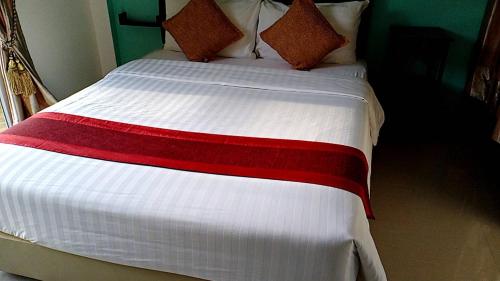 מיטה או מיטות בחדר ב-Greenfield Residence