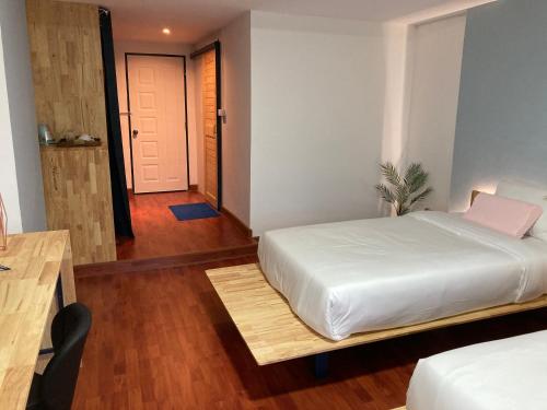 Una cama o camas en una habitación de Moocoworking