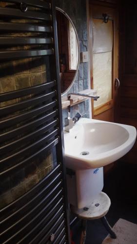 a bathroom with a sink and a mirror at Na Sluneční Pohádková chaloupka ve Sladké díře in Příchovice